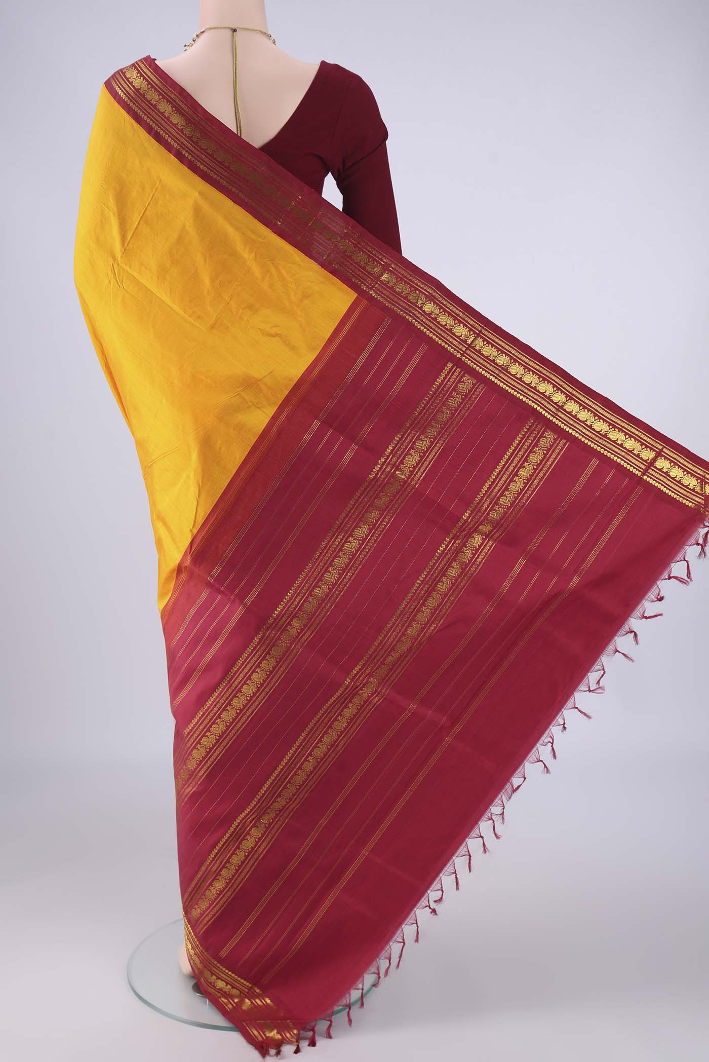 Flat view of Pure Silk Pure Zari Yellow Kanchipuram Saree with Plain Body and Zari Border. 