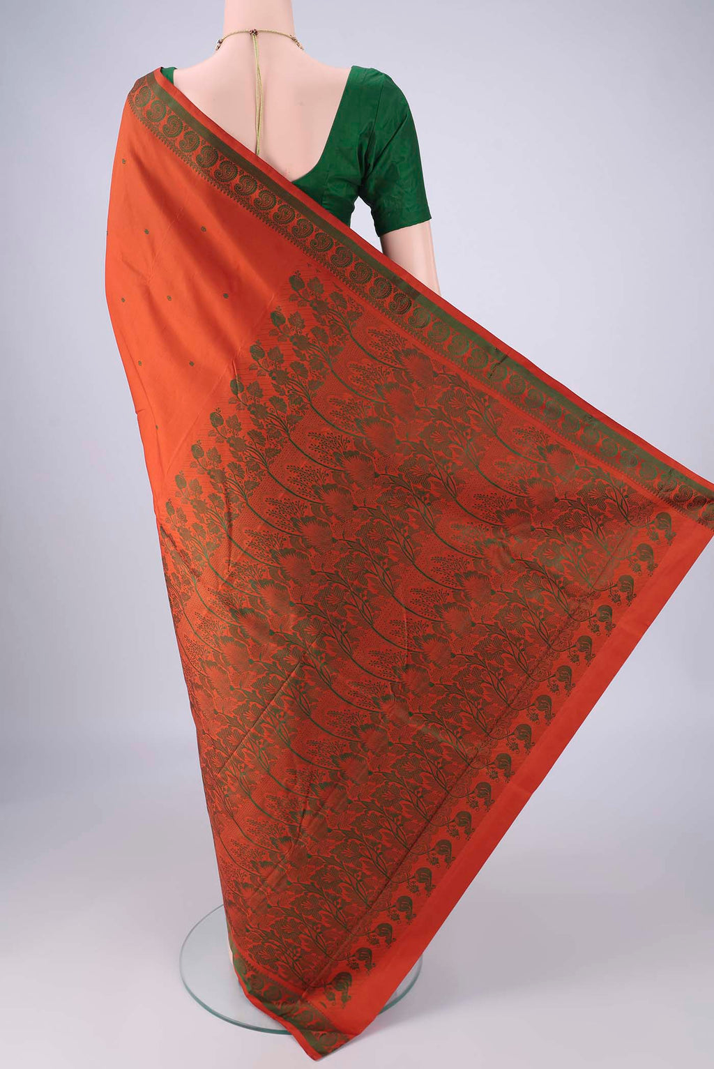 Flat view of Rust Kanchipuram Silk Saree with Thread Butta on the body and Thread Border. 