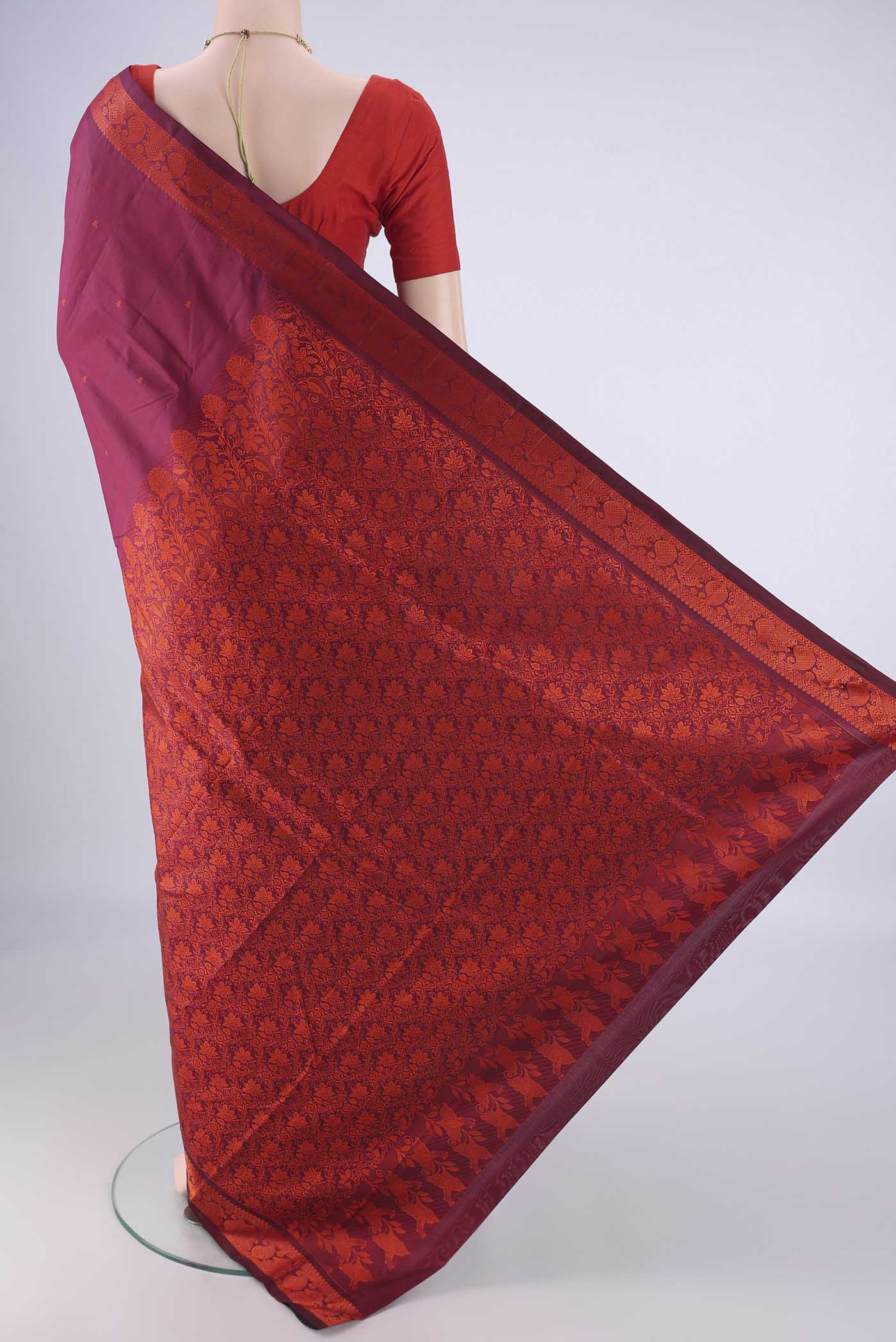 Flat view of Maroon Kanchipuram Silk Saree with Thread Butta on the body and Thread Border. 