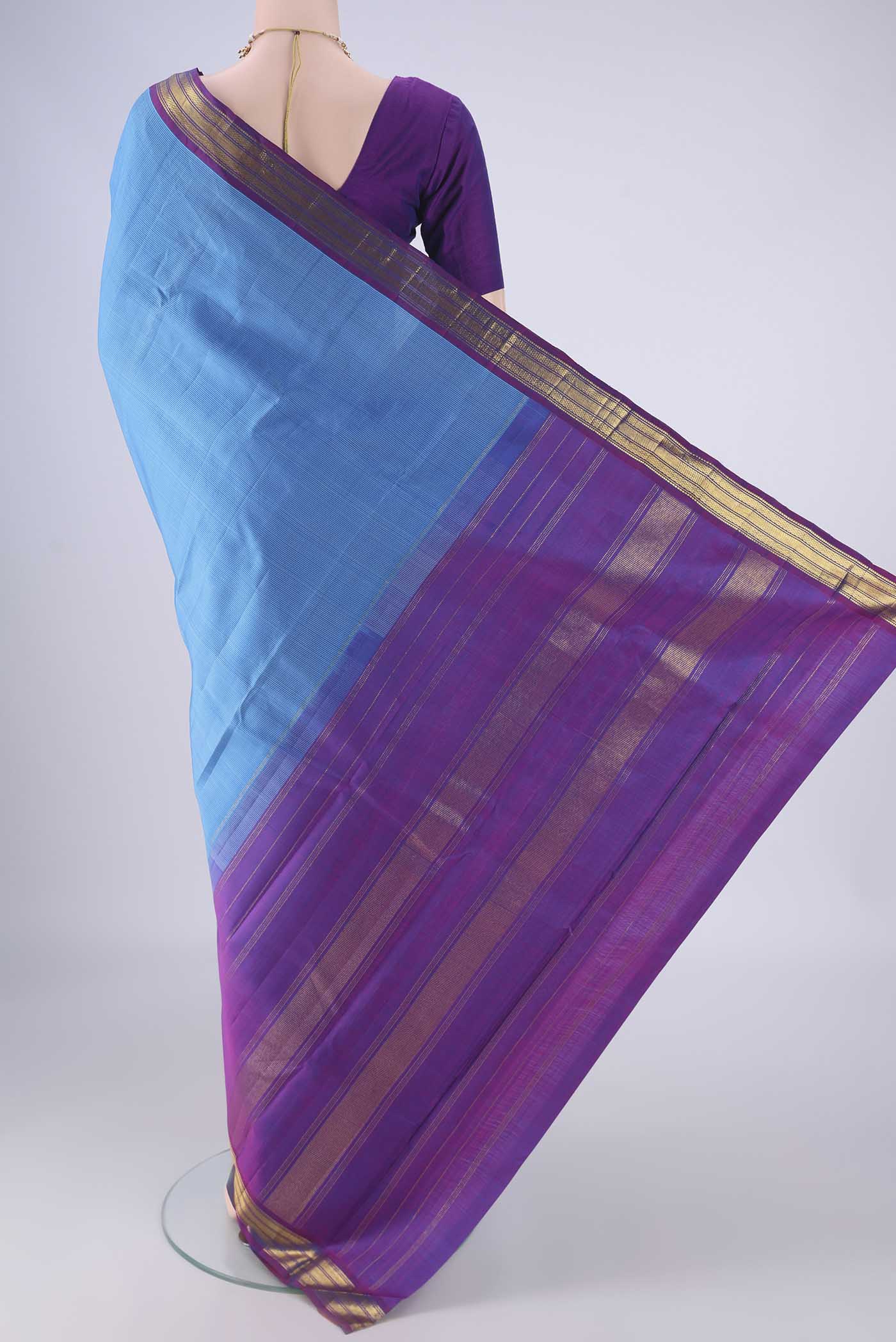 Flat view of Blue Kanjivaram Silk Saree with Stripes on the body and Zari Border. 