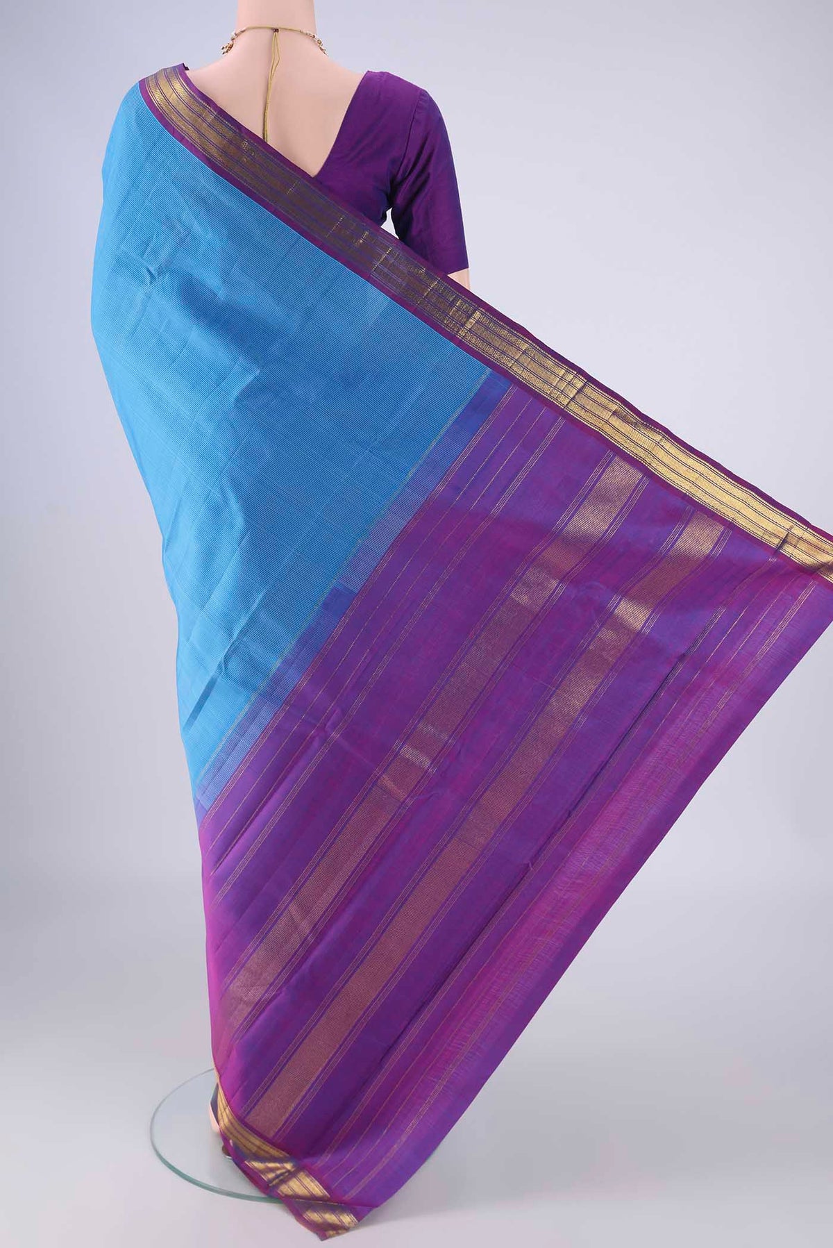 Flat view of Blue Kanjivaram Silk Saree with Stripes on the body and Zari Border. 