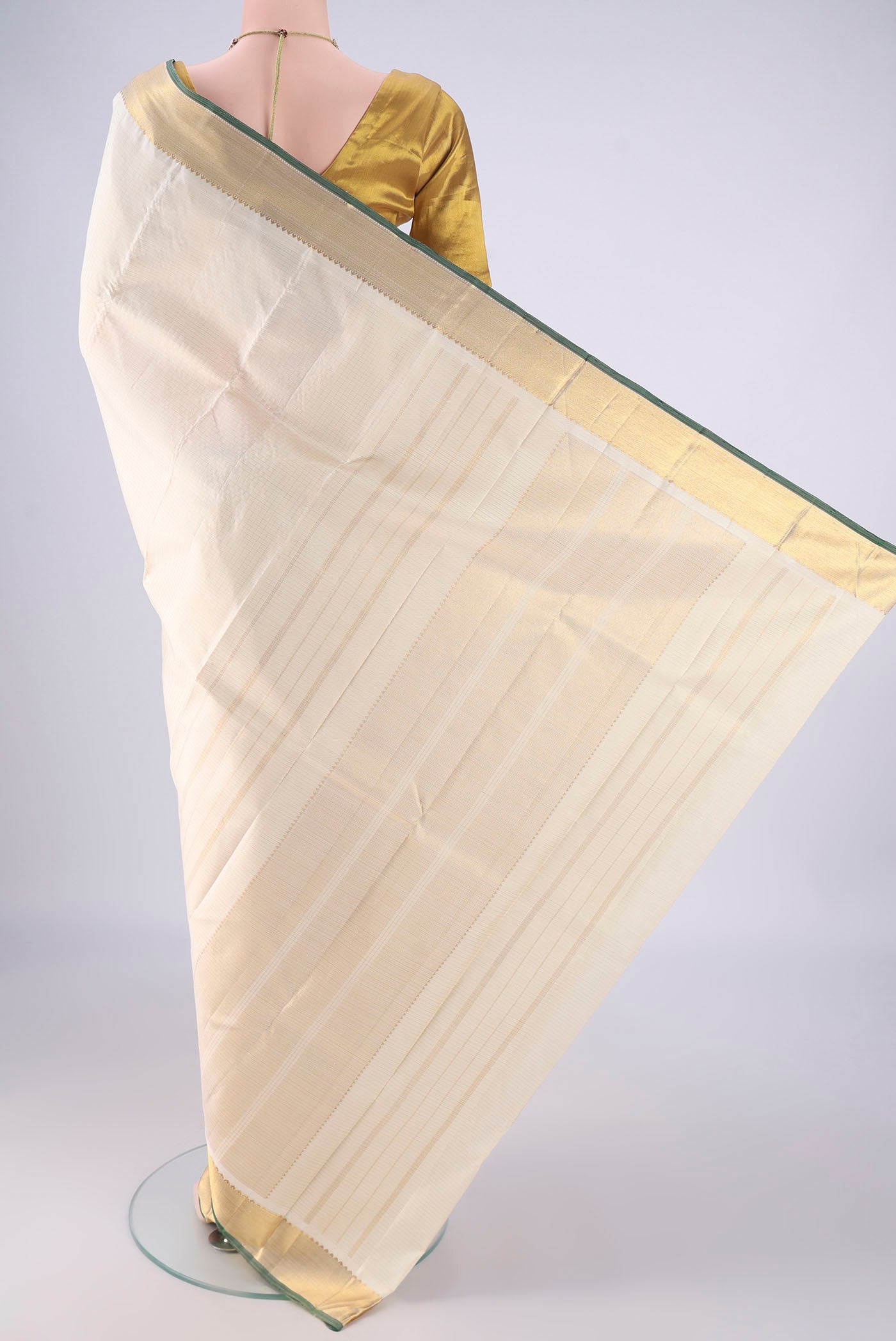 Flat view of Off White Kanchipuram Silk Saree with Checked design on the body and Zari Border. 