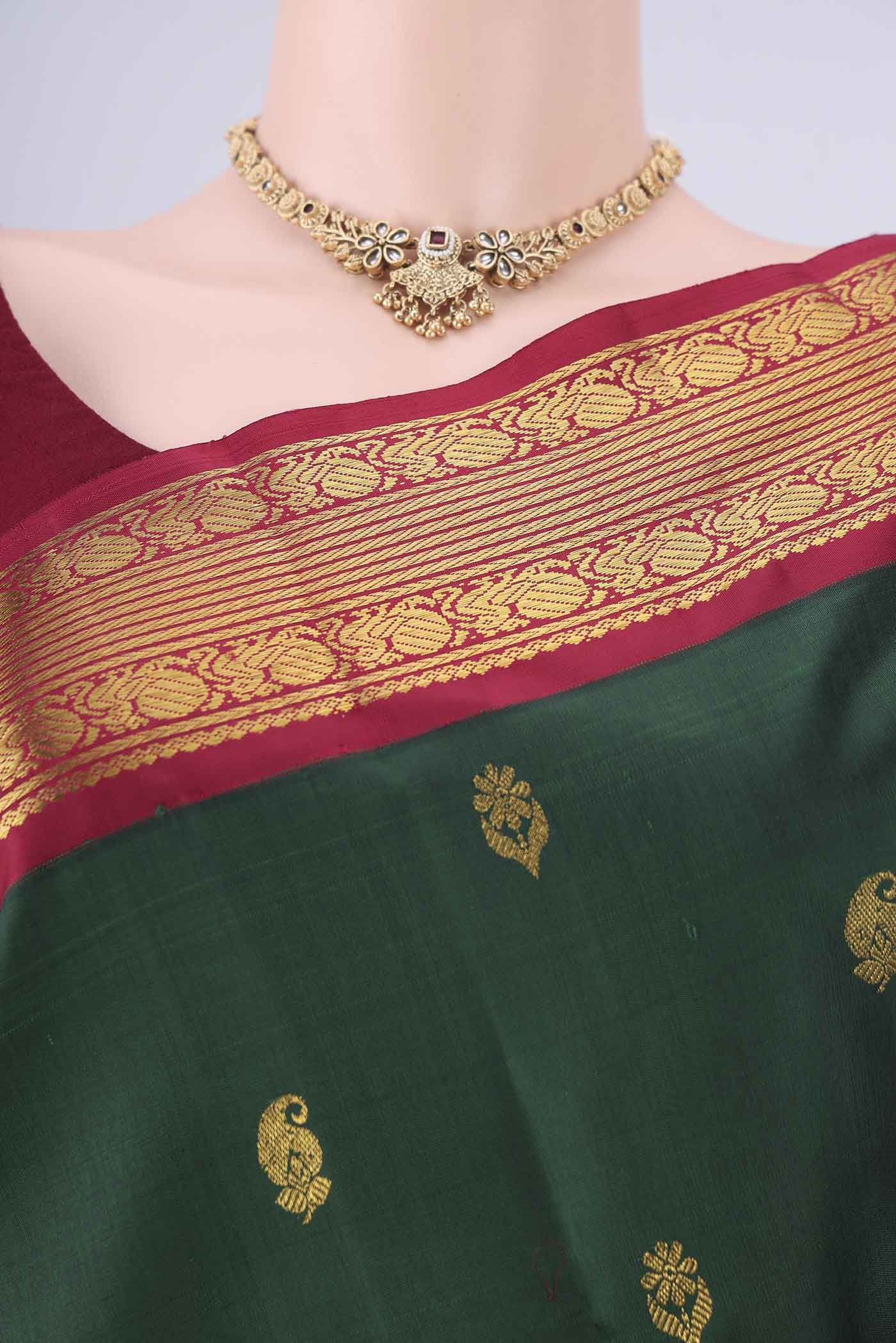 Border image of Green Kanchipuram Silk Saree with Zari Butta on the body and Zari Border. 