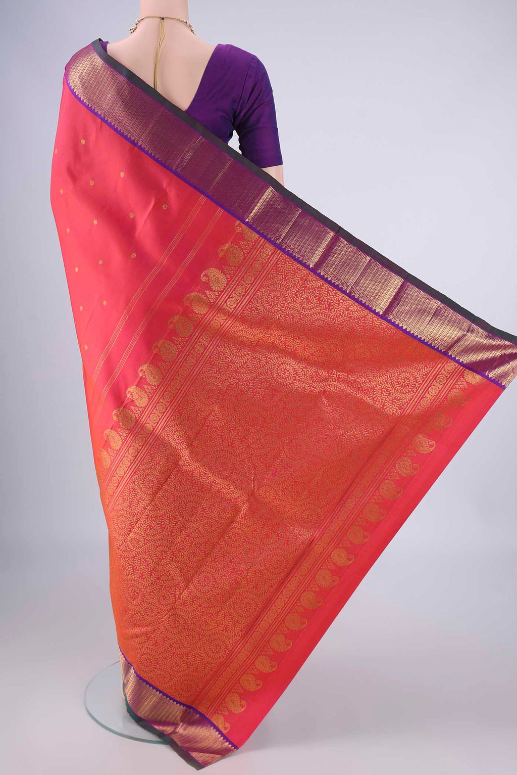 Flat view of Pink Kanchipuram Silk Saree with Zari Butta on the body and Zari Border. 