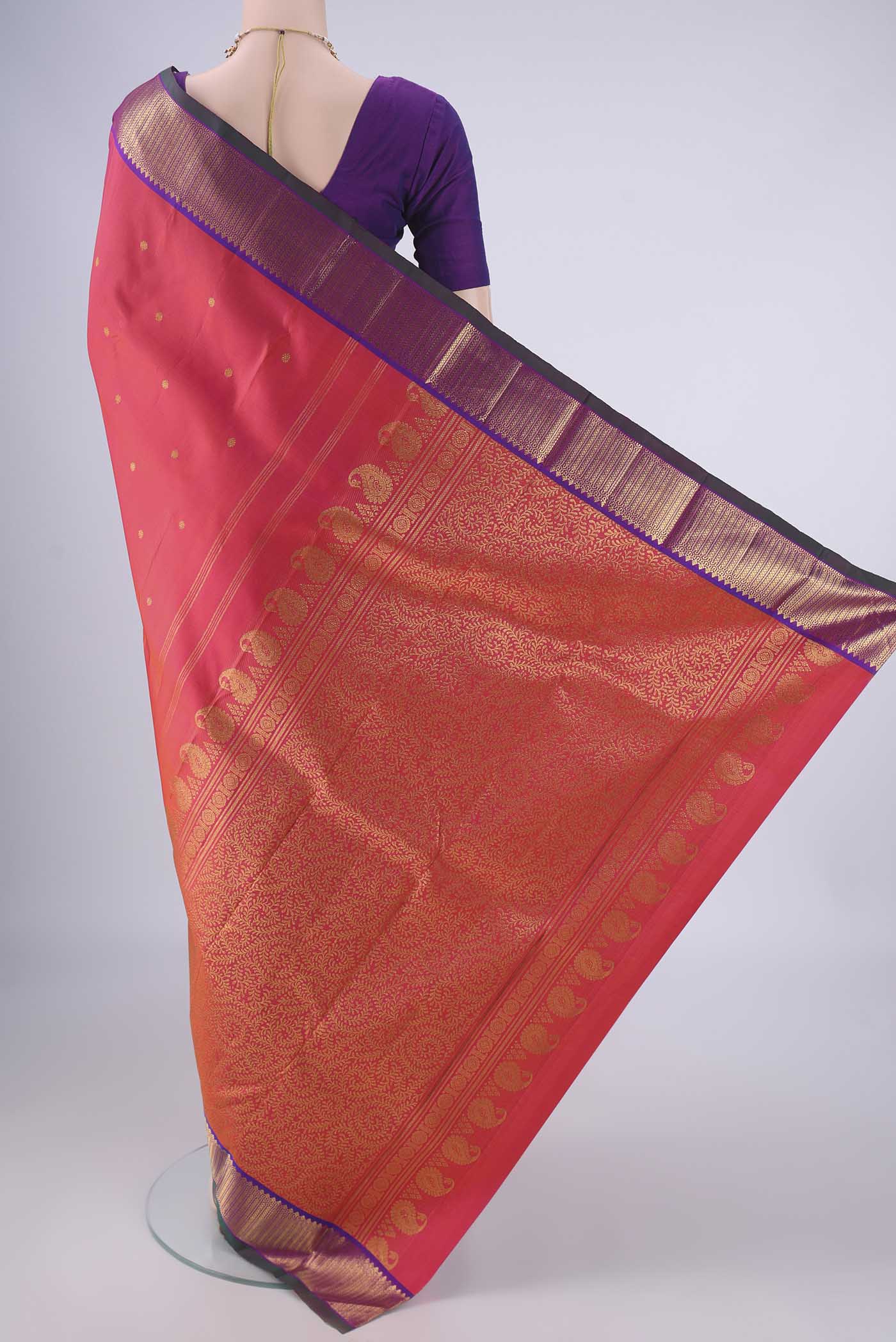 Flat view of Pink Kanchipuram Silk Saree with Zari Butta on the body and Zari Border. 