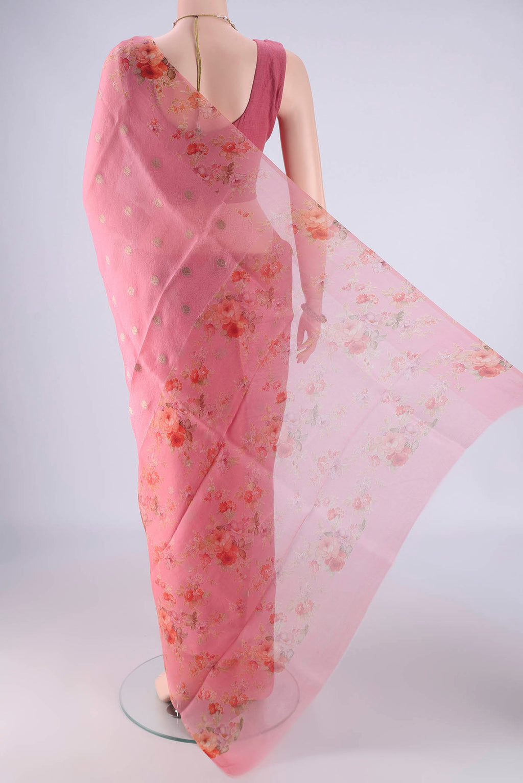 Flat view of Rose pink Organza Silk Saree with Jacquard With Zari Butta on the body and Printed Border. 