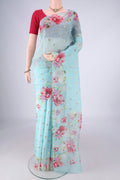 Light Blue Organza Silk Saree with Zari Butta on the body and Printed Border.  displayed on a mannequin
