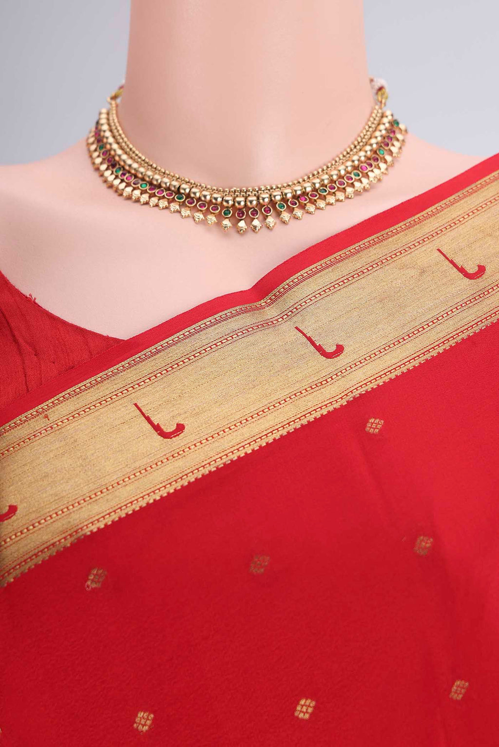 Border image of Red Mysore Crepe Saree with Zari Butta on the body and Zari Border. 