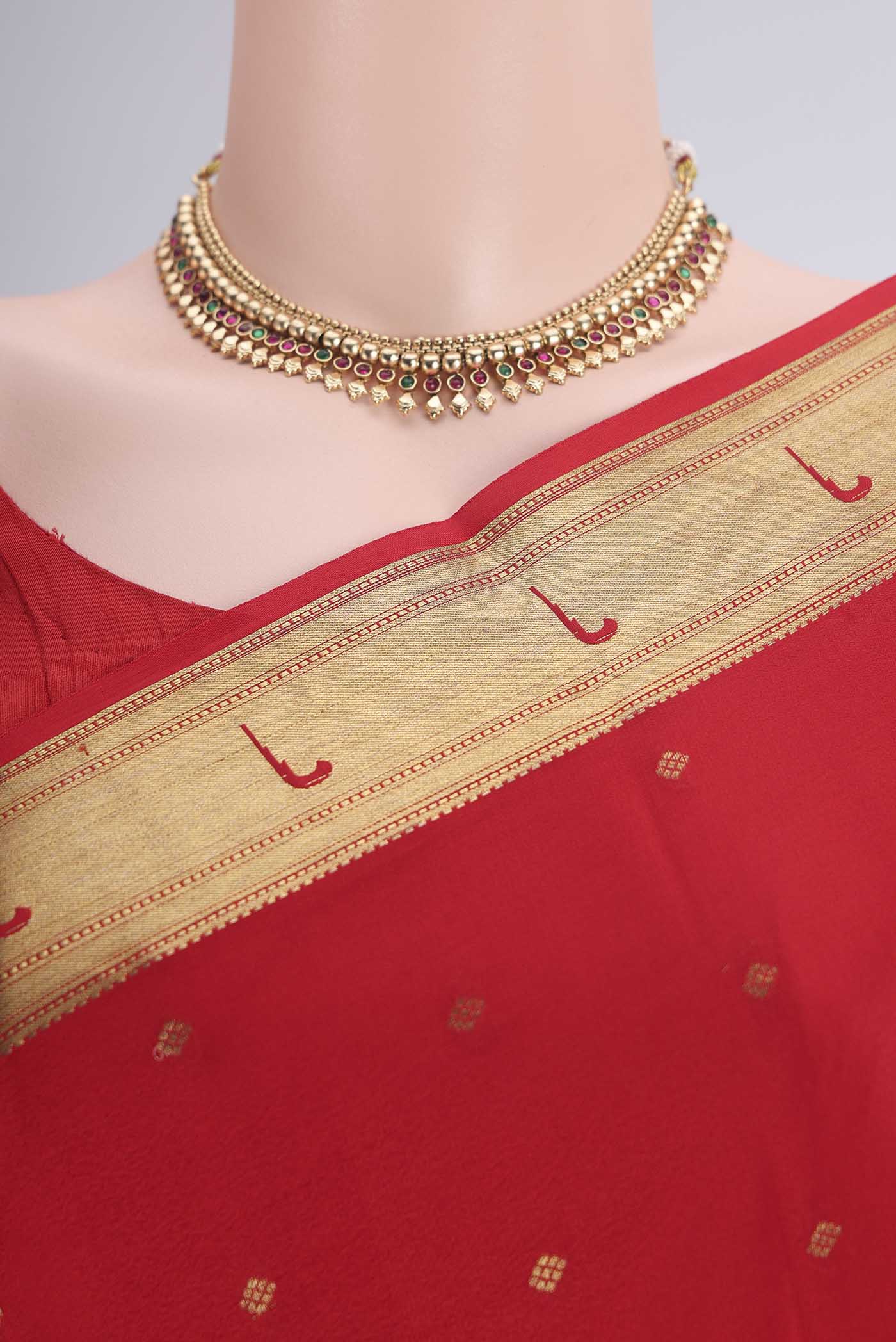 Border image of Red Mysore Crepe Saree with Zari Butta on the body and Zari Border. 