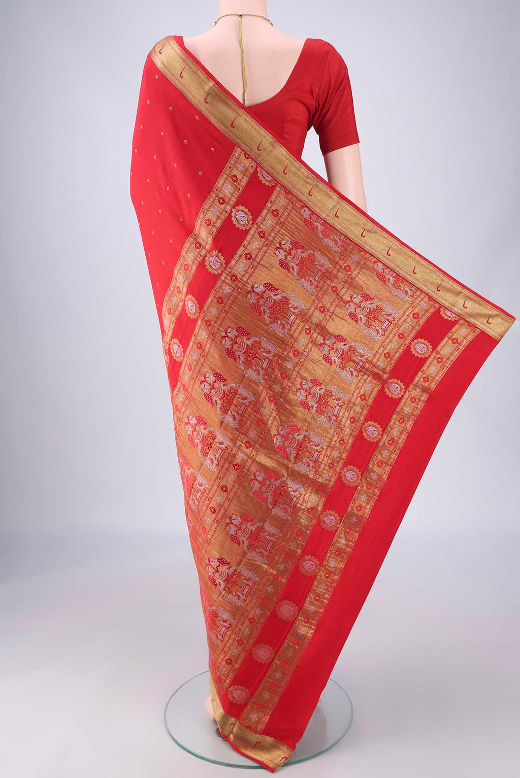 Flat view of Red Mysore Crepe Saree with Zari Butta on the body and Zari Border. 