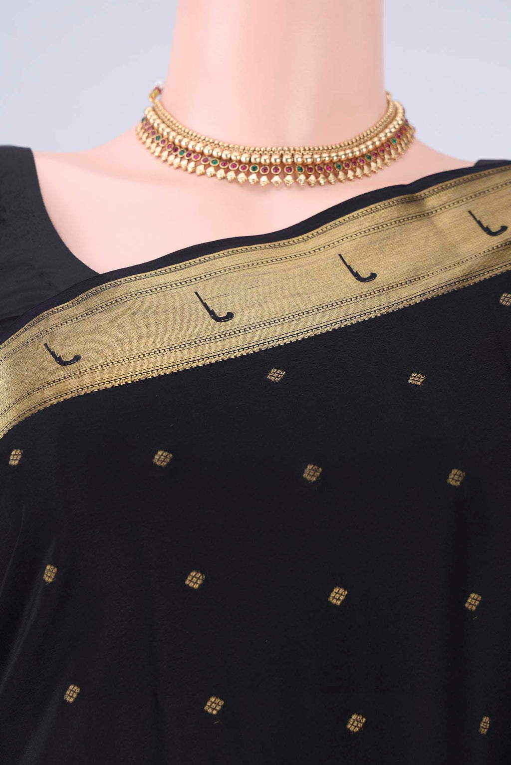 Border image of Black Mysore Crepe Saree with Zari Butta on the body and Zari Border. 