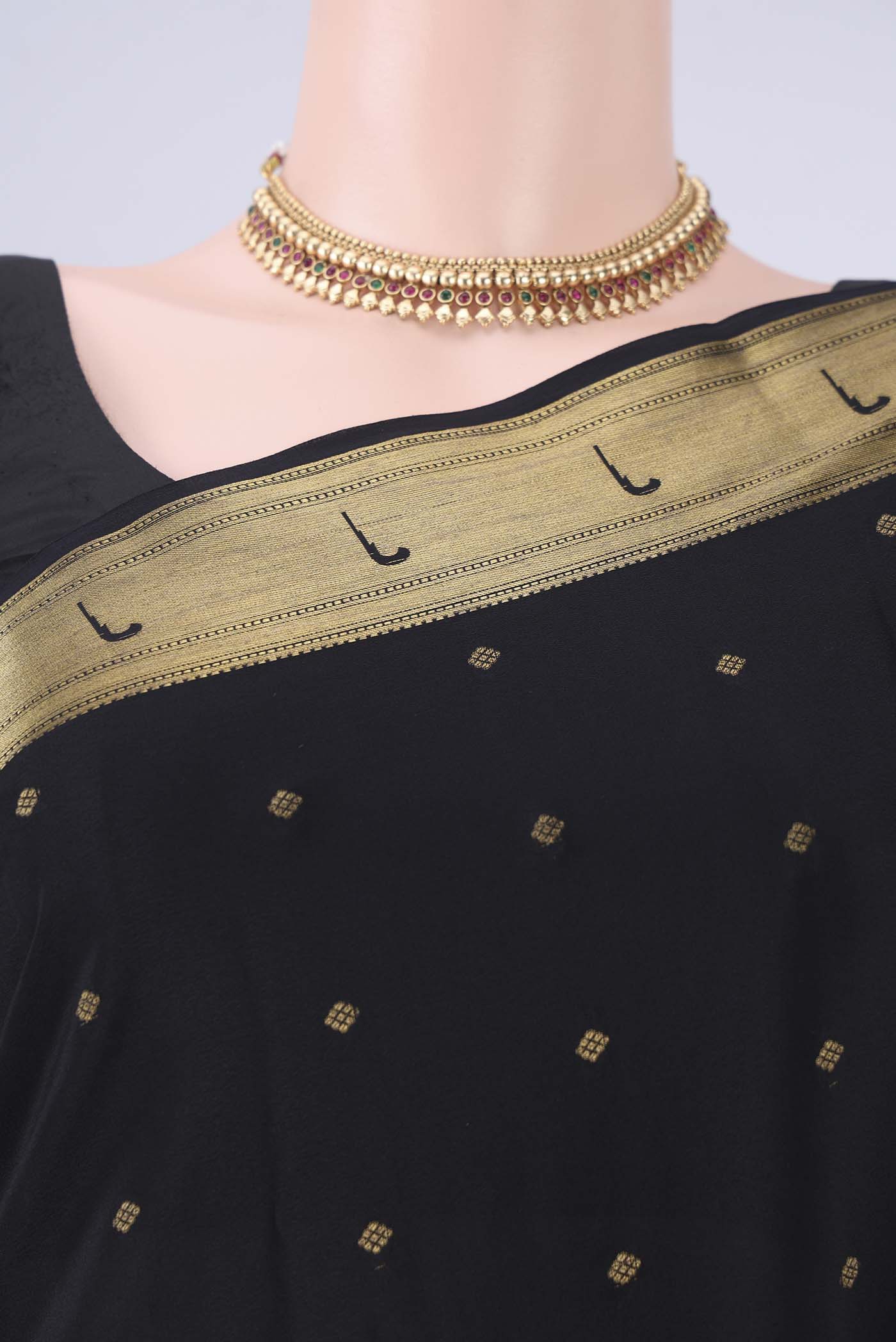 Border image of Black Mysore Crepe Saree with Zari Butta on the body and Zari Border. 