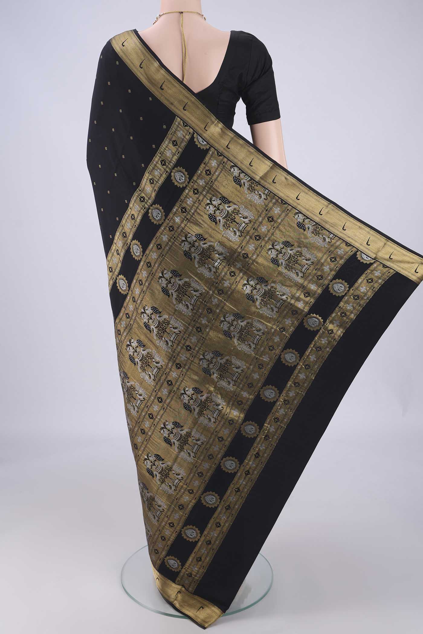 Flat view of Black Mysore Crepe Saree with Zari Butta on the body and Zari Border. 