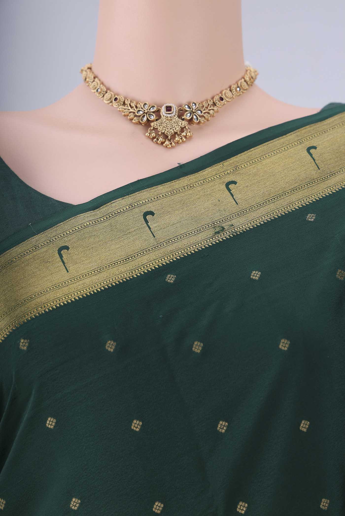 Border image of Bottle Green Mysore Crepe Saree with Zari Butta on the body and Zari Border. 