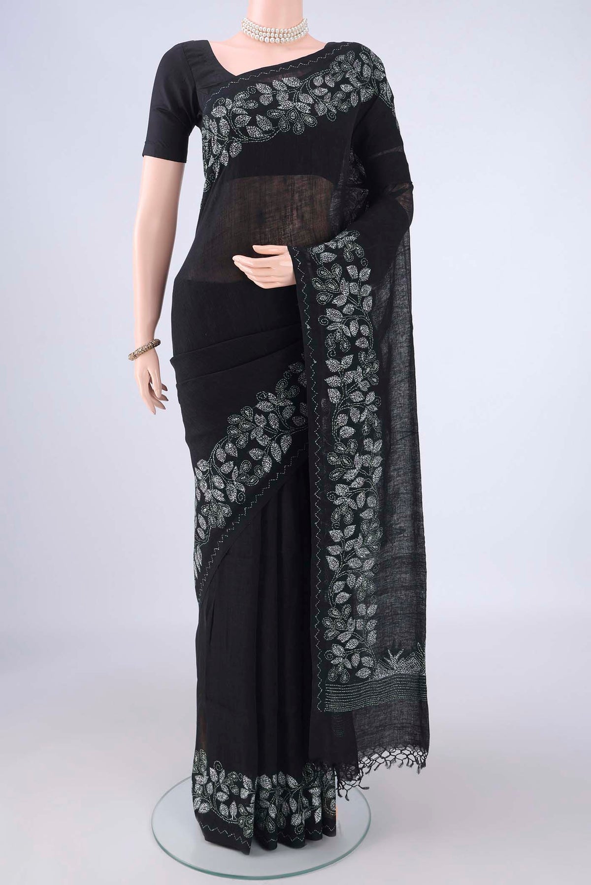 Black Linen Saree with Kantha Work on the body and Embroidery Border.  displayed on a mannequin