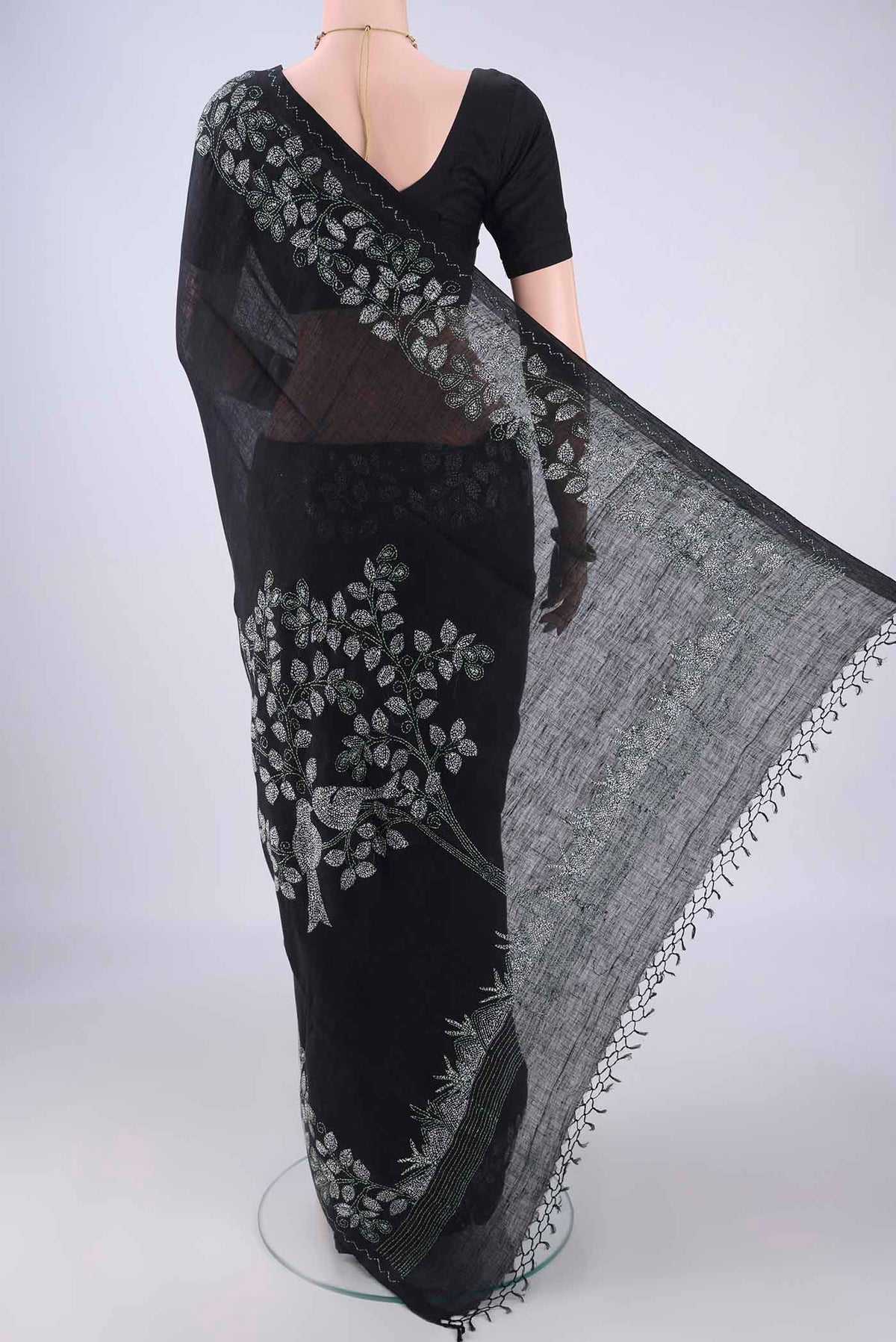 Flat view of Black Linen Saree with Kantha Work on the body and Embroidery Border. 
