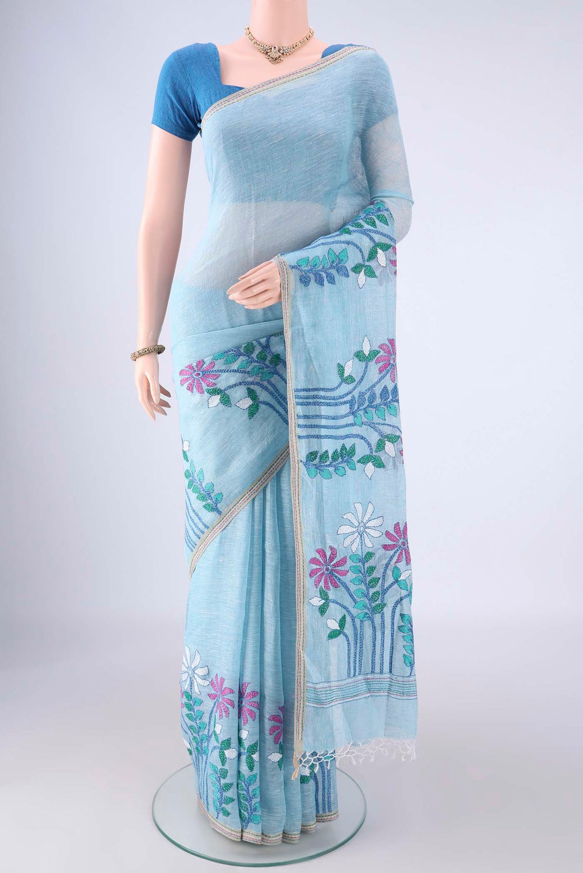 Sky Blue Linen Saree with Kantha Work on the body and Thread Border.  displayed on a mannequin