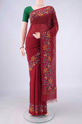Maroon Linen Saree with Kantha Work on the body and Embroidery Border.  displayed on a mannequin