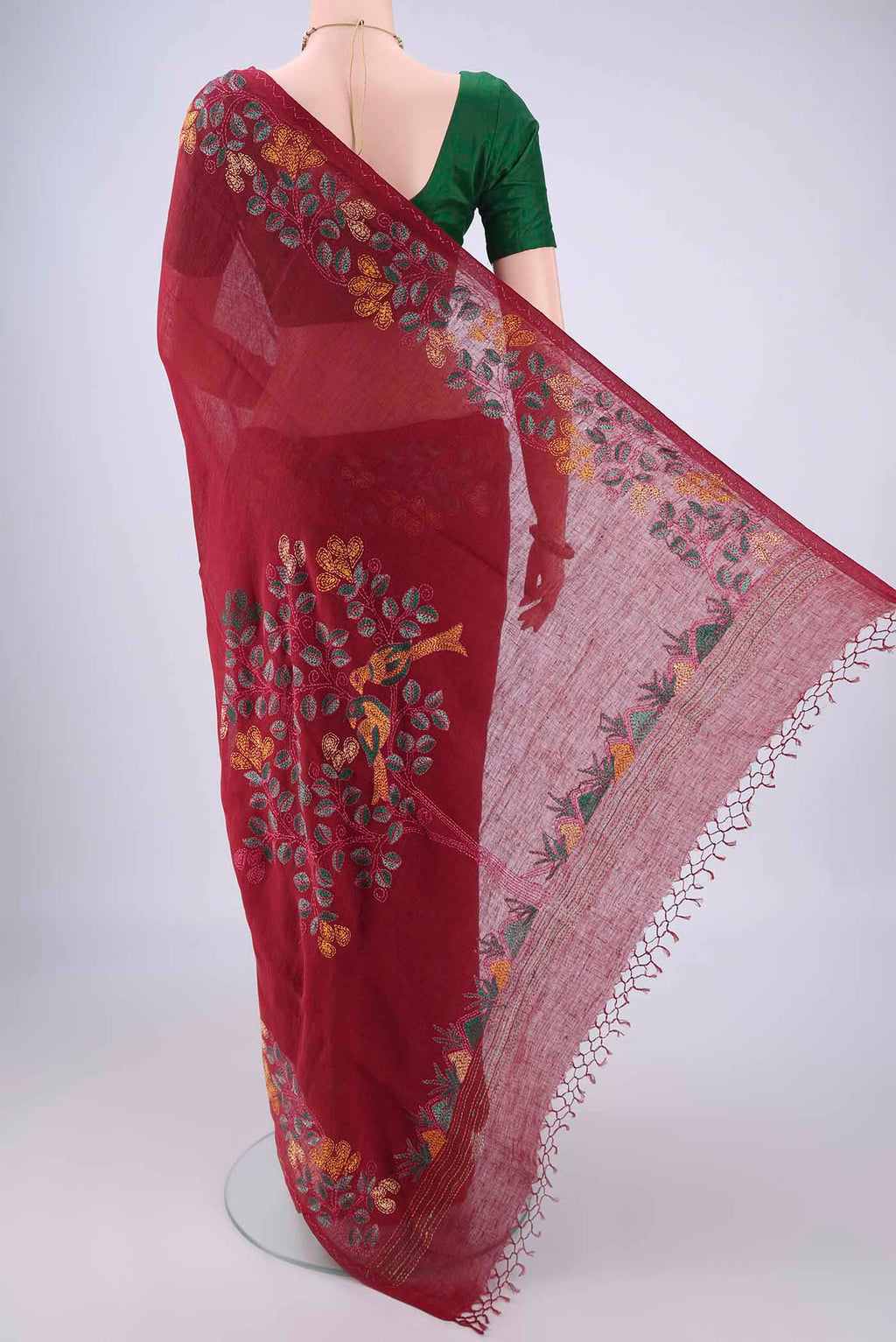Flat view of Maroon Linen Saree with Kantha Work on the body and Embroidery Border. 