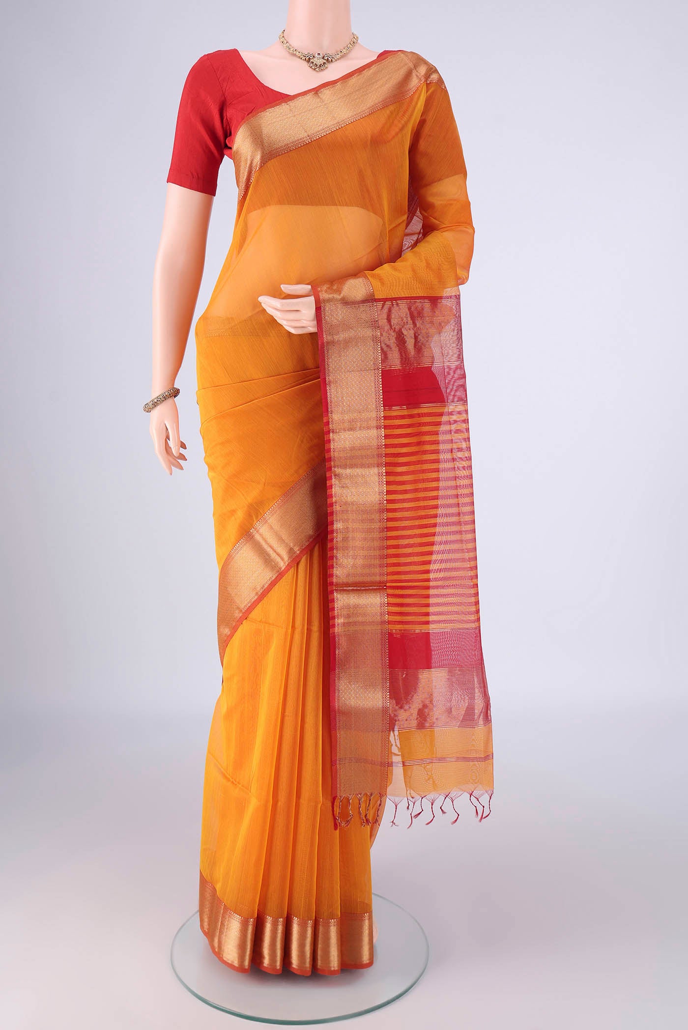 Yellow Maheshwari Silk Cotton Saree with Plain Body and Zari Border.  displayed on a mannequin