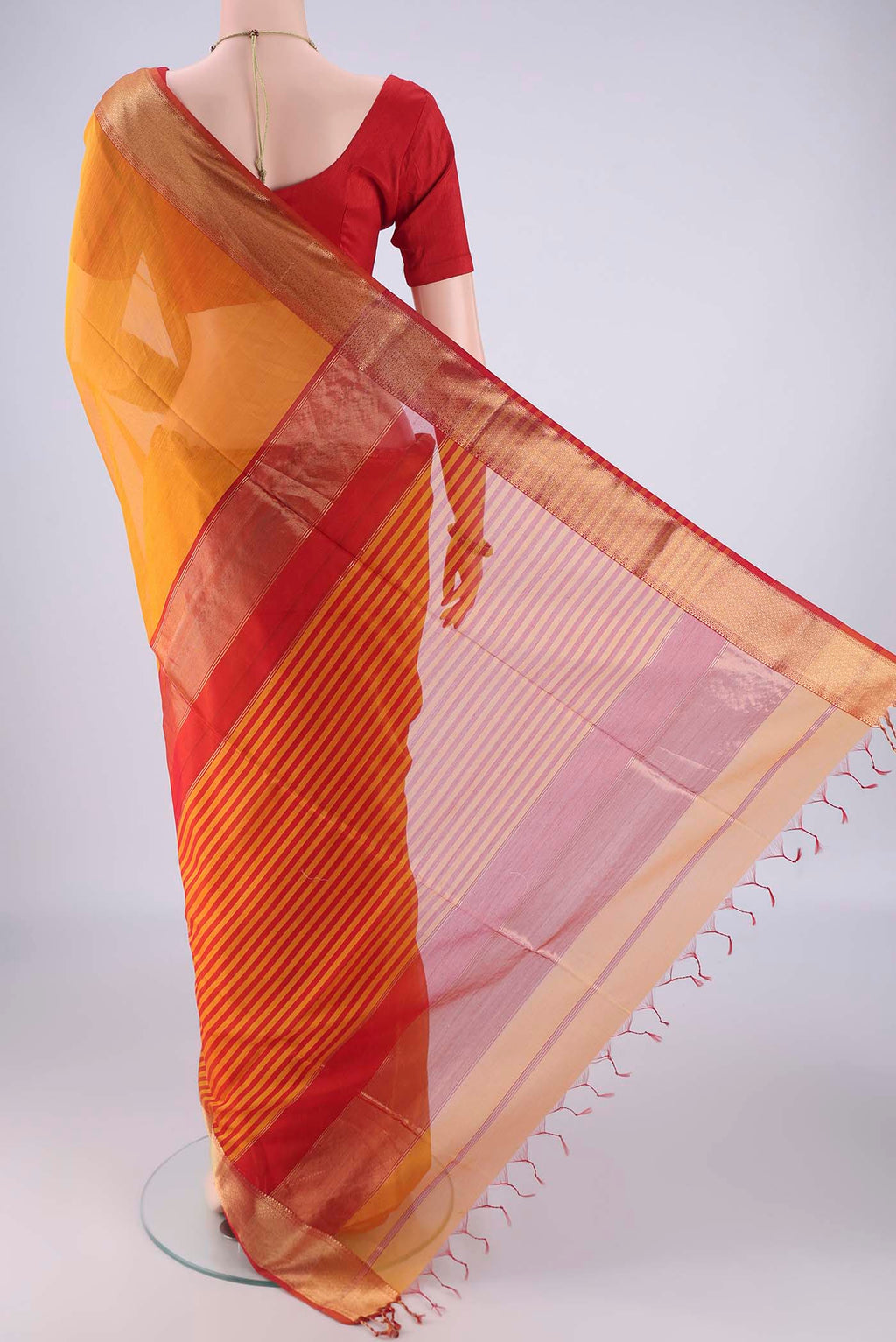 Flat view of Yellow Maheshwari Silk Cotton Saree with Plain Body and Zari Border. 