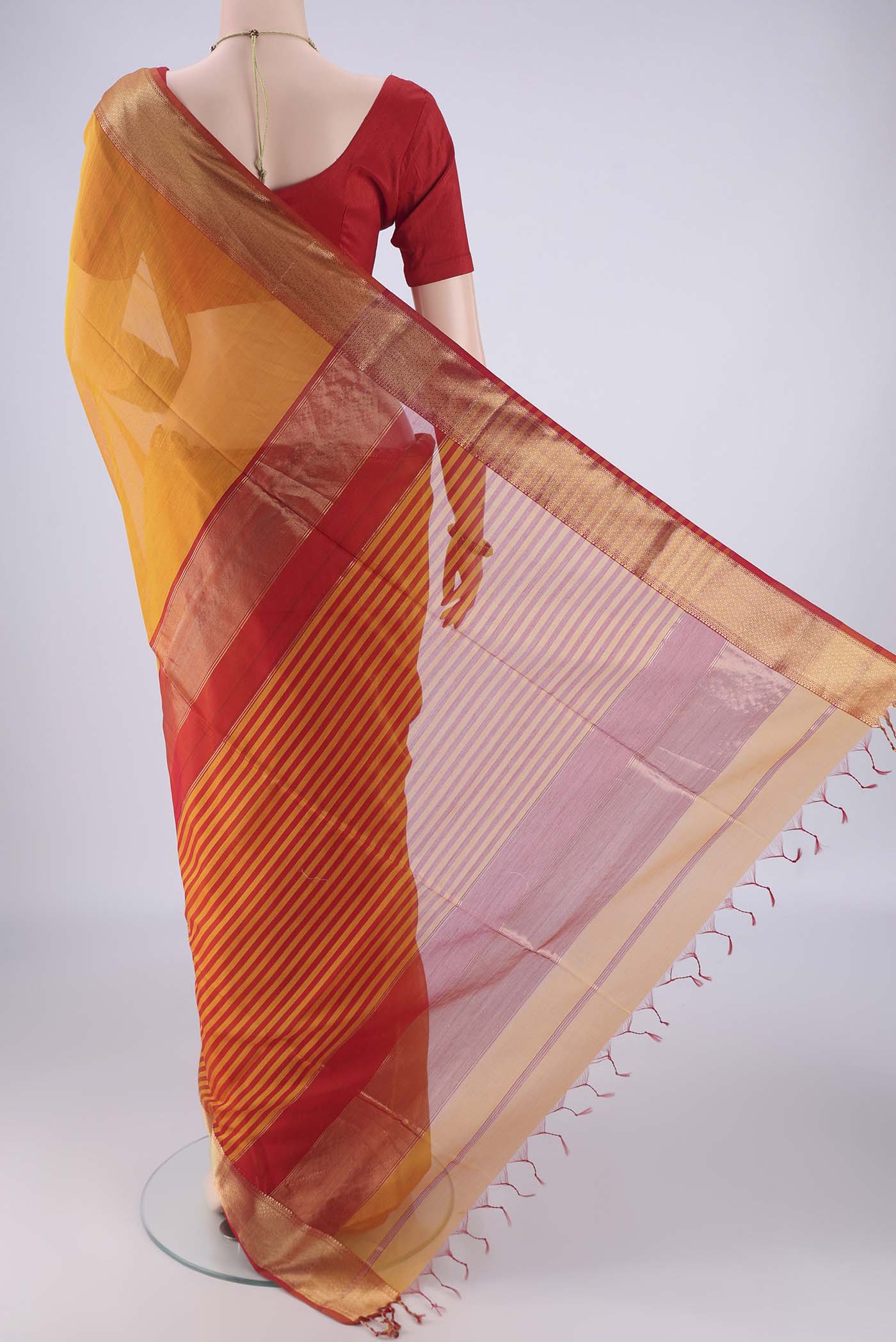 Flat view of Yellow Maheshwari Silk Cotton Saree with Plain Body and Zari Border. 
