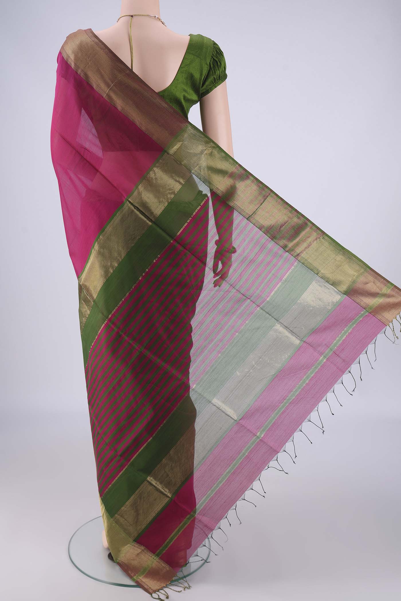 Flat view of Magenta Maheshwari Silk Cotton Saree with Plain Body and Zari Border. 