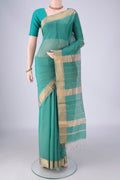 Sea Green Maheshwari Silk Cotton Saree with Stripes on the body and Zari Border.  displayed on a mannequin