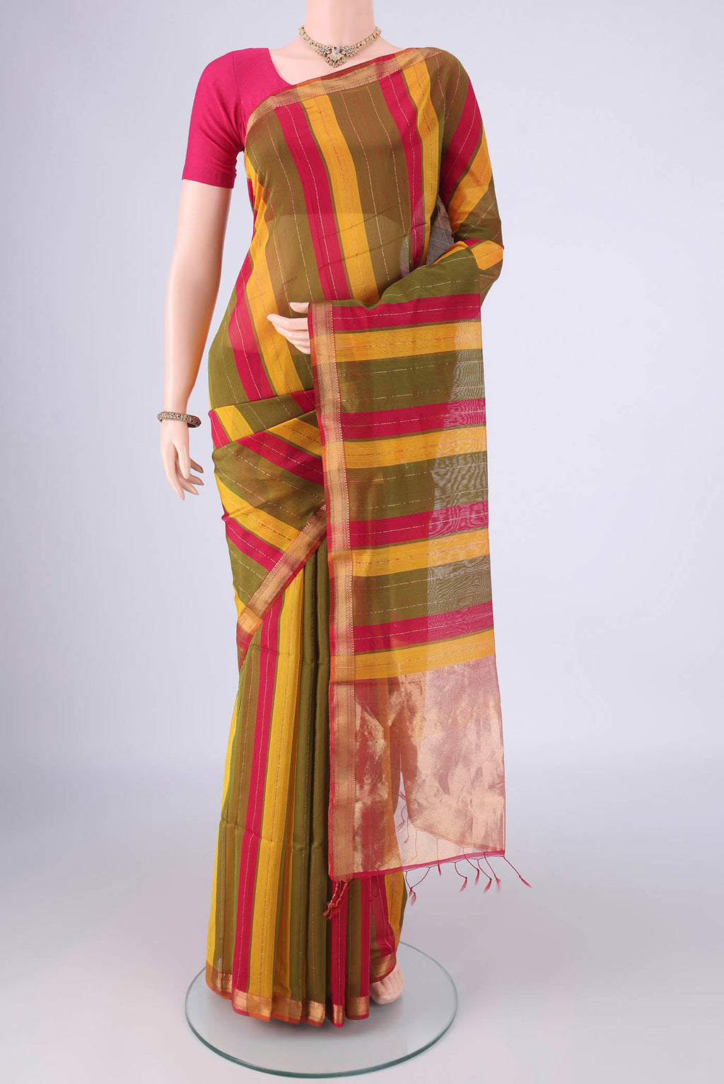 Multi Color Maheshwari Silk Cotton Saree with Stripes on the body and Zari Border.  displayed on a mannequin