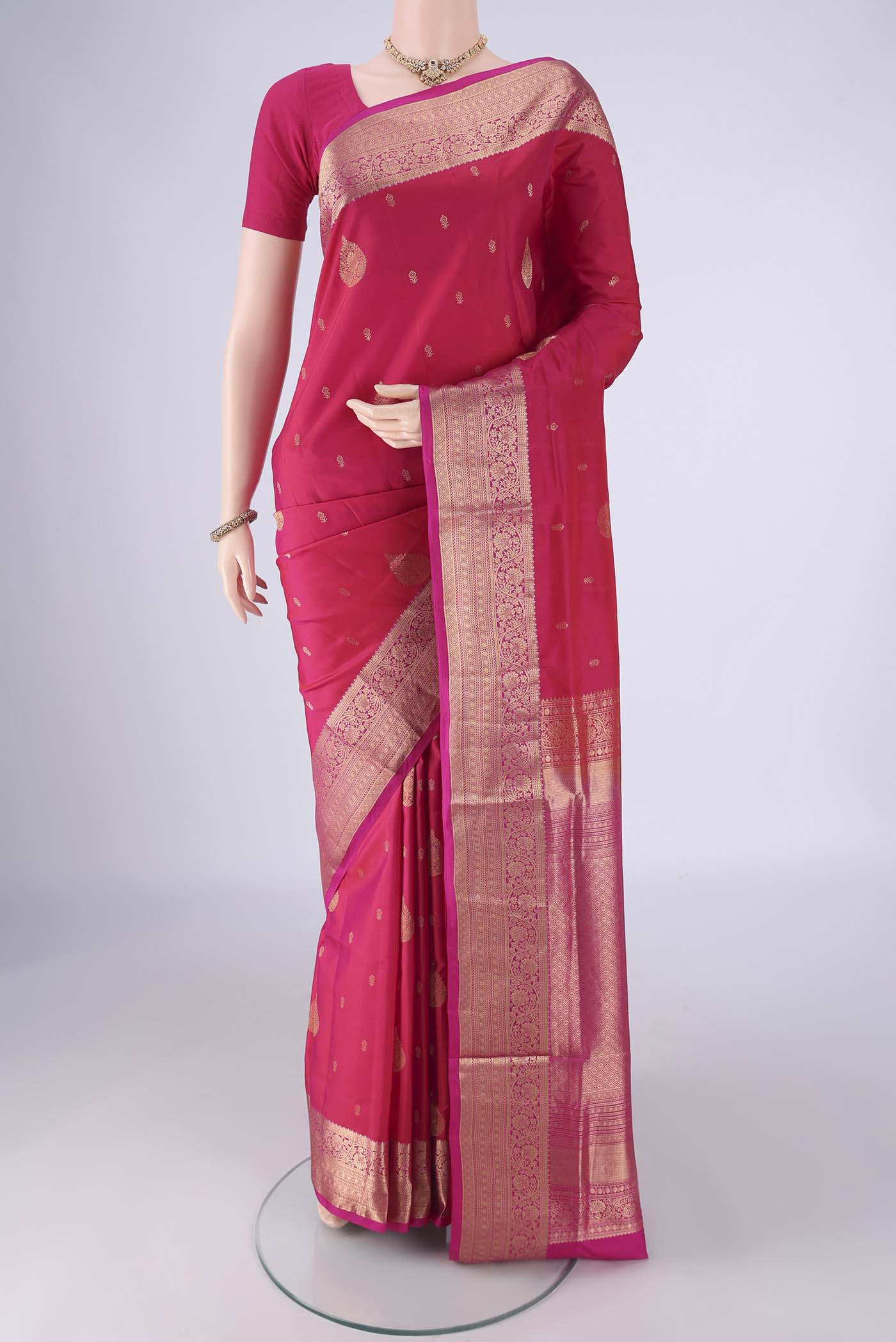 Pink Soft Silk Saree with Zari Butta on the body and Zari Border.  displayed on a mannequin