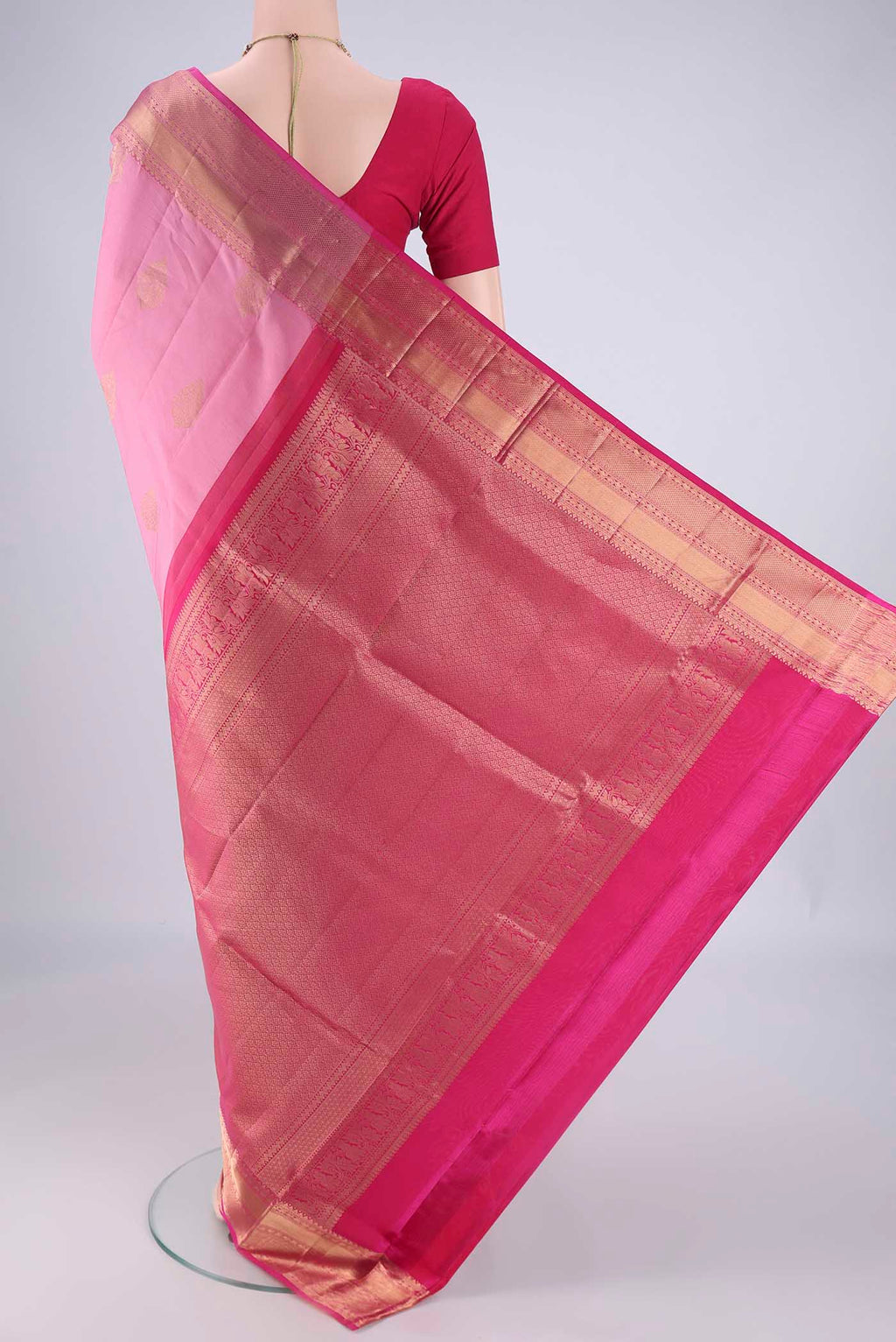Flat view of Rose pink Soft Silk Saree with Zari Butta on the body and Zari Border. 