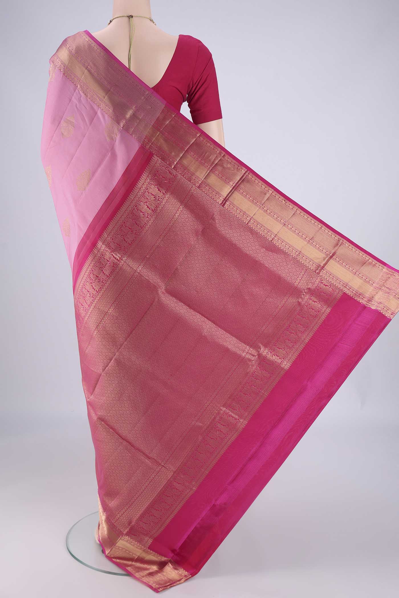Flat view of Rose pink Soft Silk Saree with Zari Butta on the body and Zari Border. 
