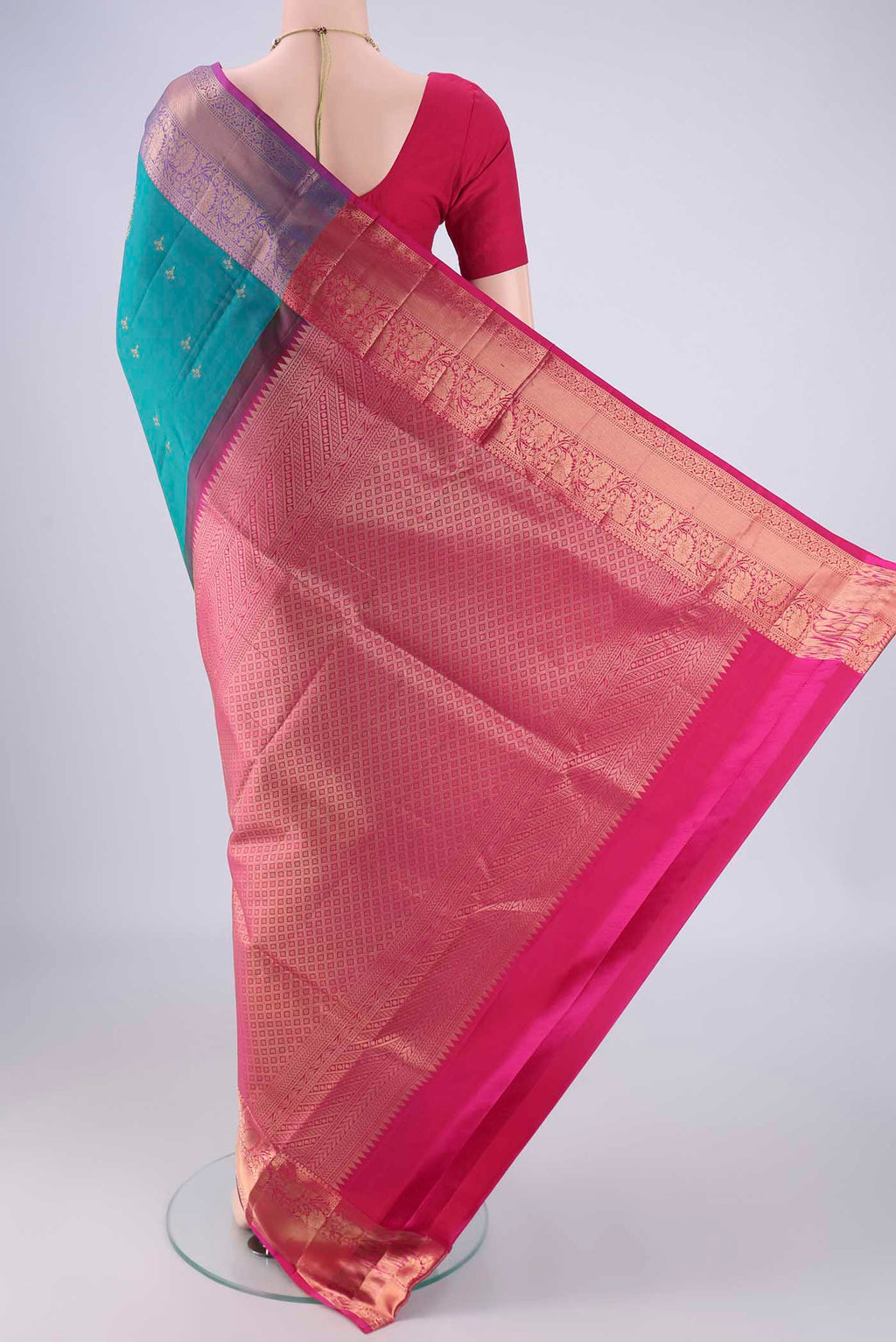 Flat view of Turquoise Soft Silk Saree with Zari Butta on the body and Zari Border. 