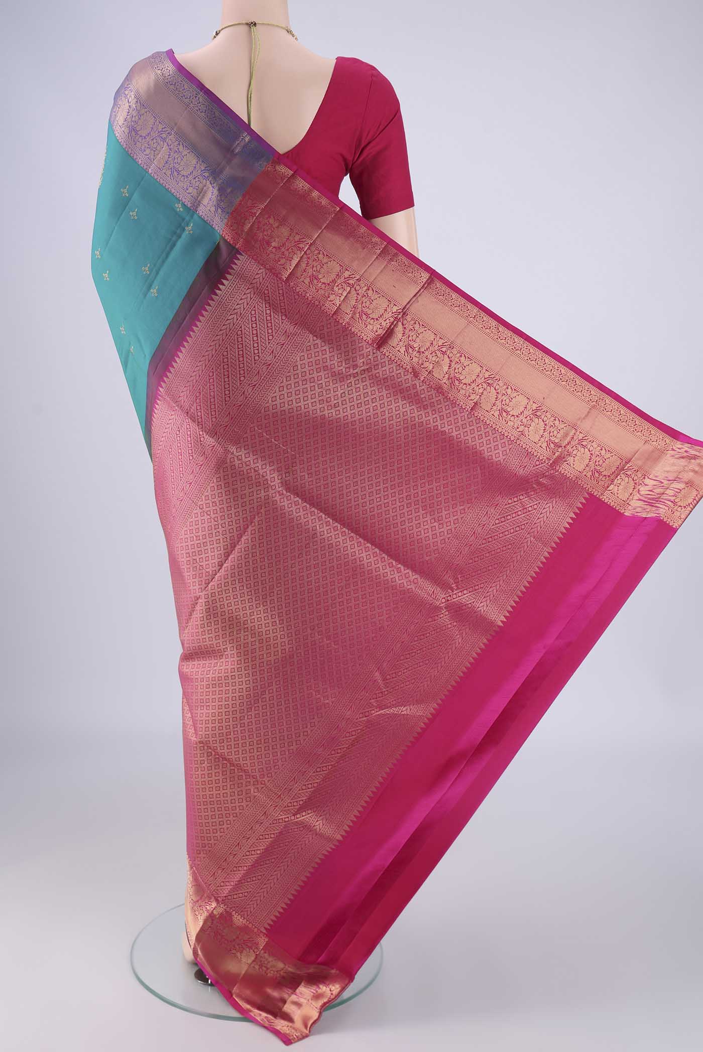 Flat view of Turquoise Soft Silk Saree with Zari Butta on the body and Zari Border. 