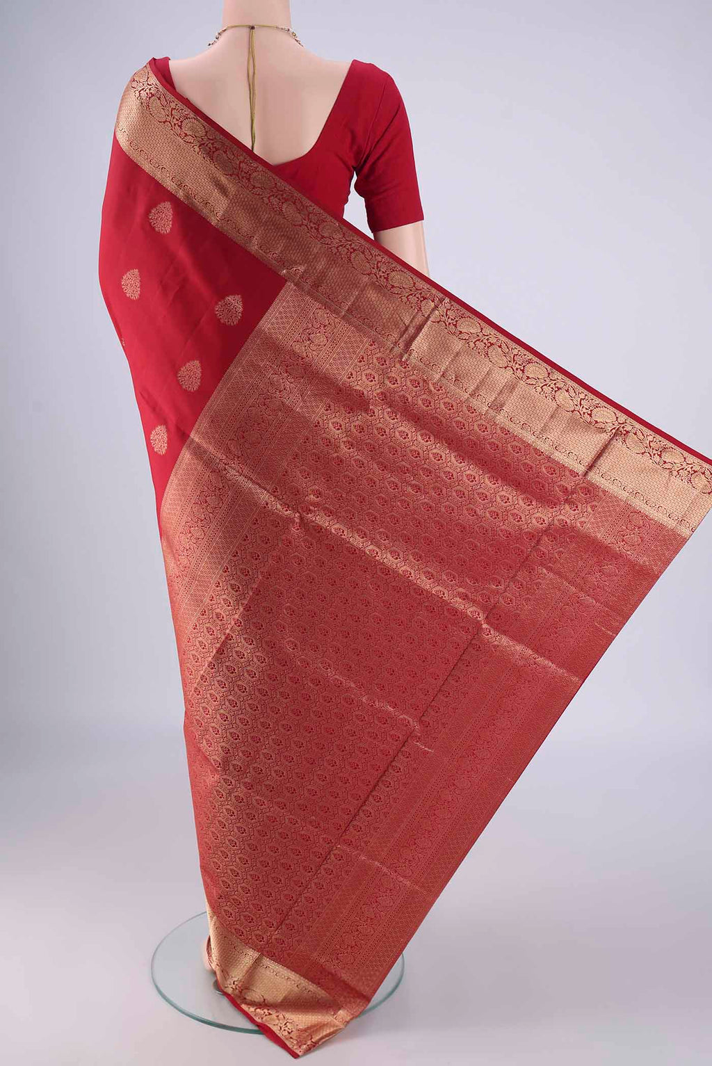 Flat view of Maroon Soft Silk Saree with Zari Butta on the body and Zari Border. 