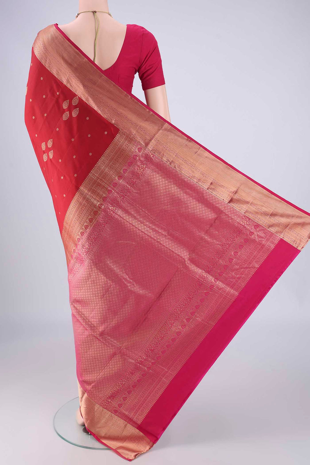 Flat view of Maroon Soft Silk Saree with Zari Butta on the body and Zari Border. 