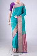 Blue Soft Silk Saree with Zari Butta on the body and Zari Border.  displayed on a mannequin