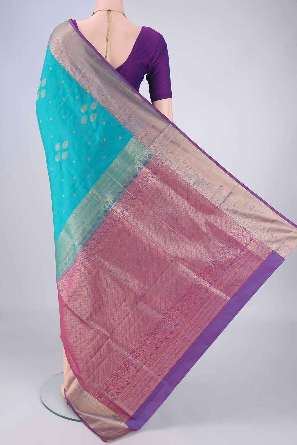 Flat view of Blue Soft Silk Saree with Zari Butta on the body and Zari Border. 