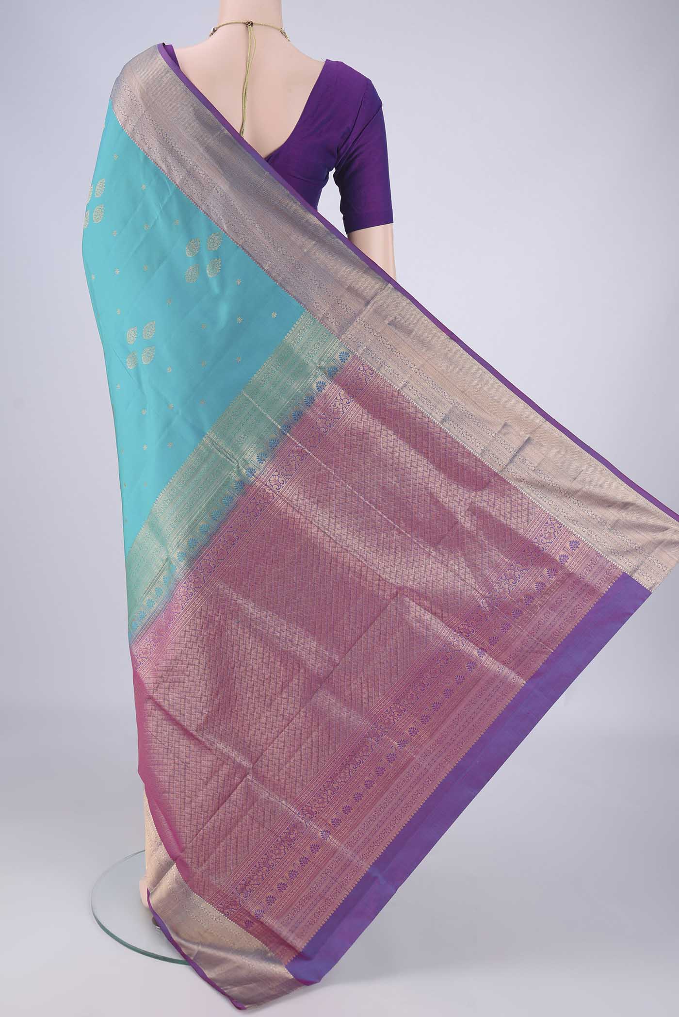 Flat view of Blue Soft Silk Saree with Zari Butta on the body and Zari Border. 