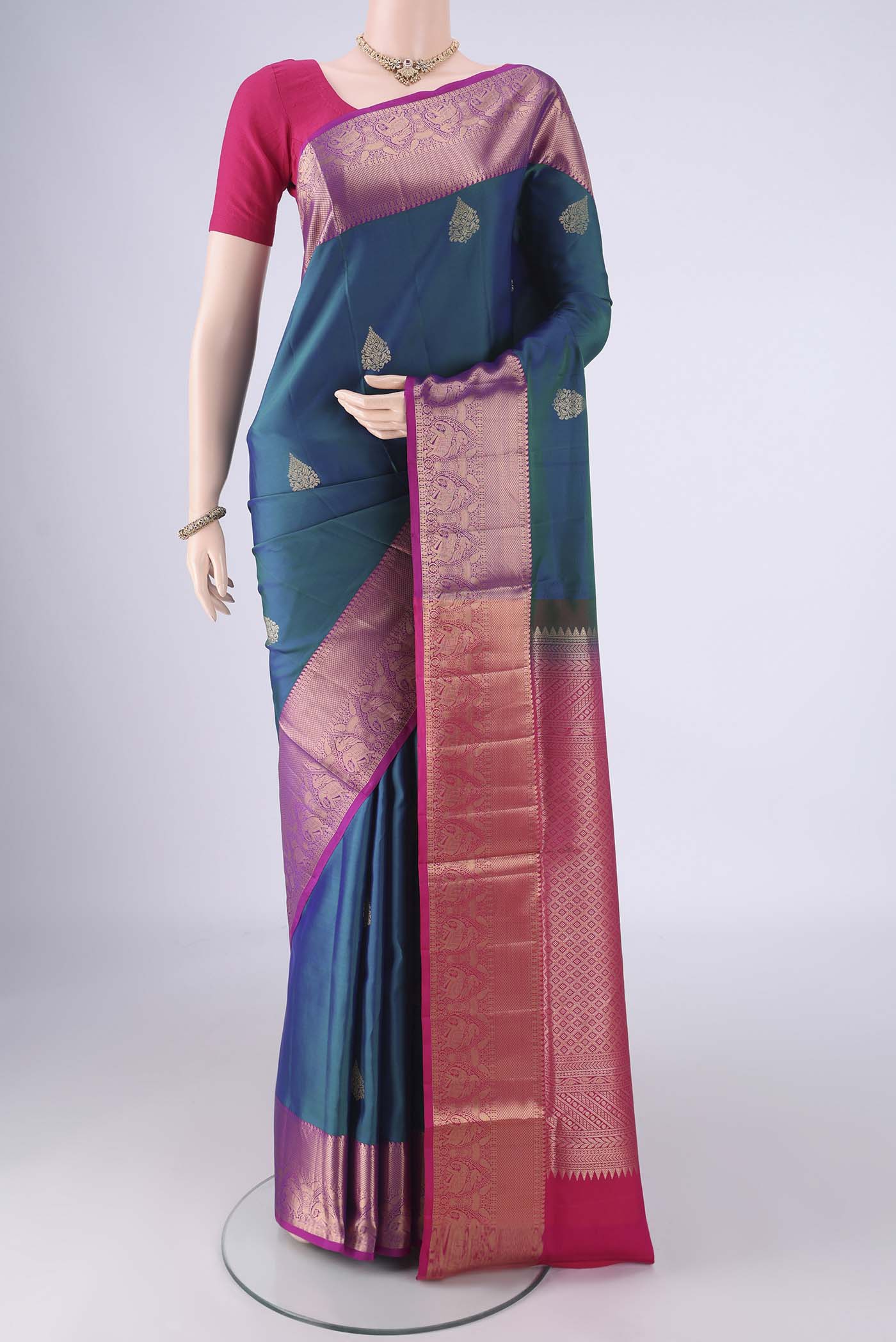 Blue Soft Silk Saree with Zari Butta on the body and Zari Border.  displayed on a mannequin
