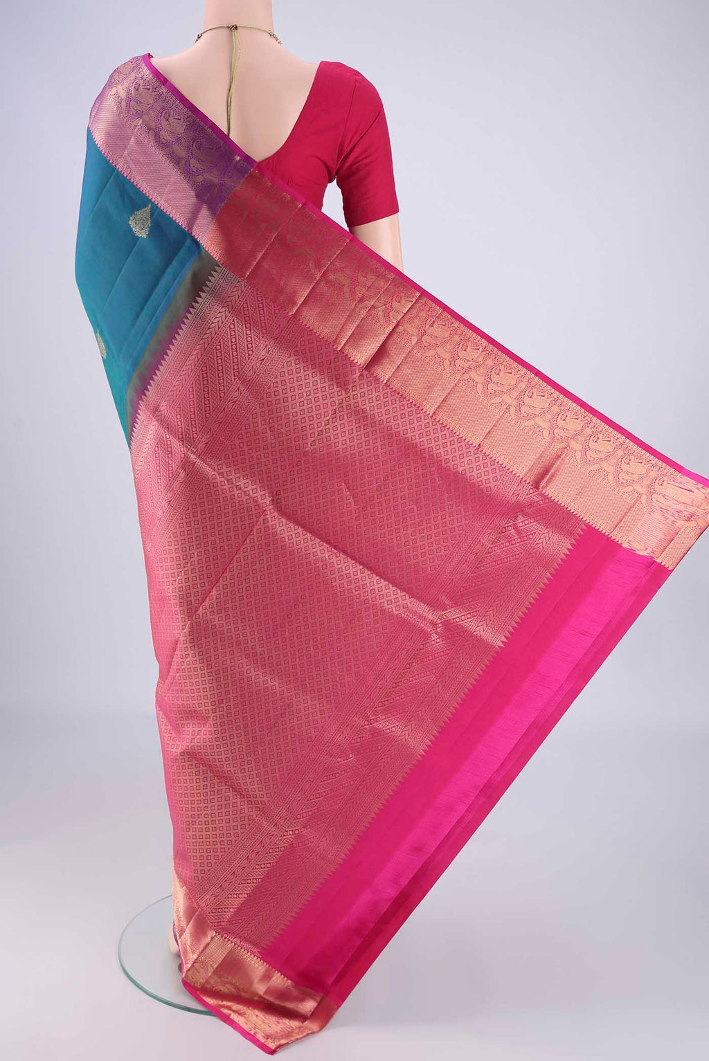 Flat view of Blue Soft Silk Saree with Zari Butta on the body and Zari Border. 