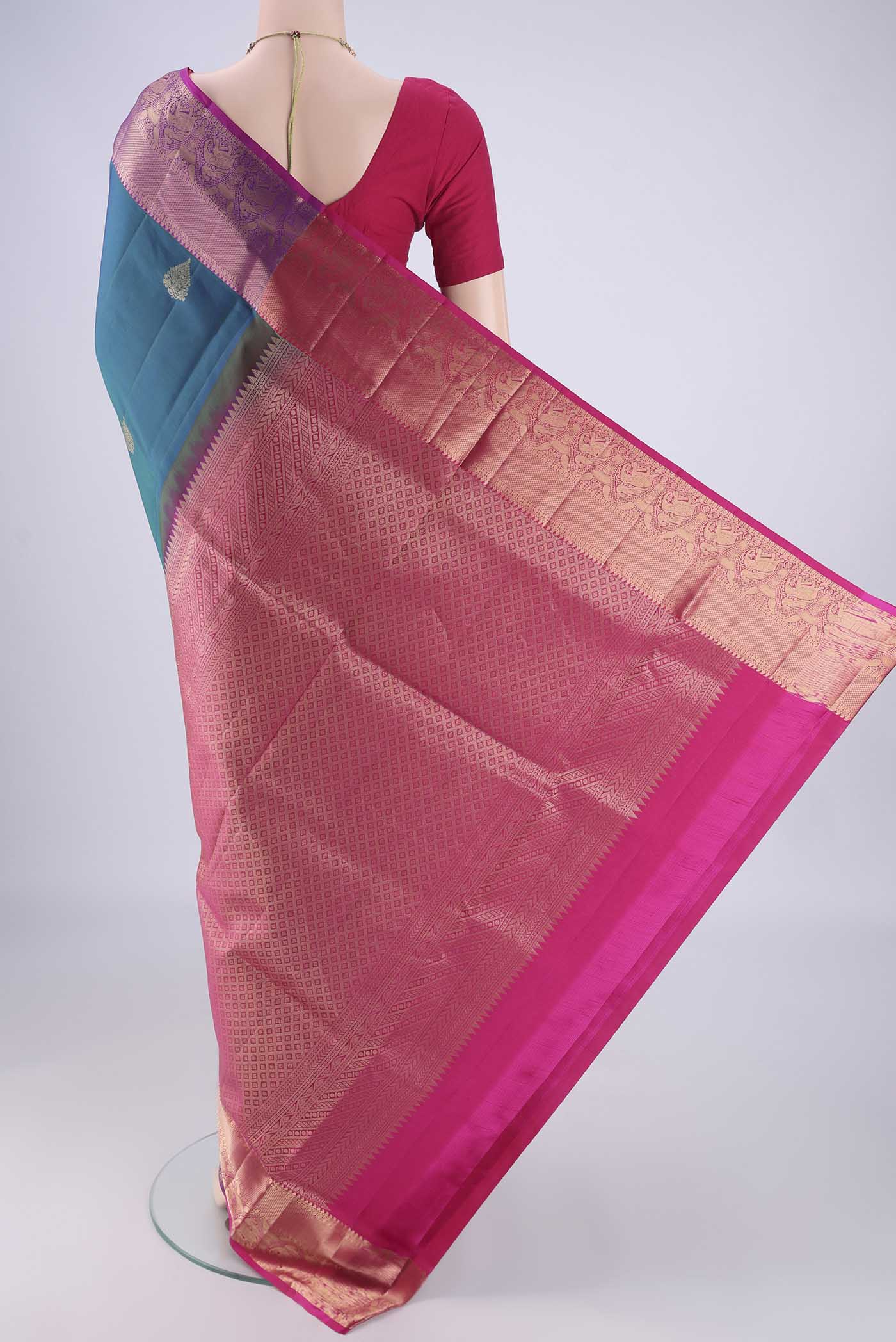 Flat view of Blue Soft Silk Saree with Zari Butta on the body and Zari Border. 