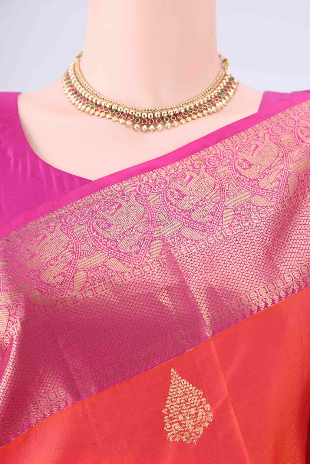 Border image of Orange Soft Silk Saree with Zari Butta on the body and Zari Border. 