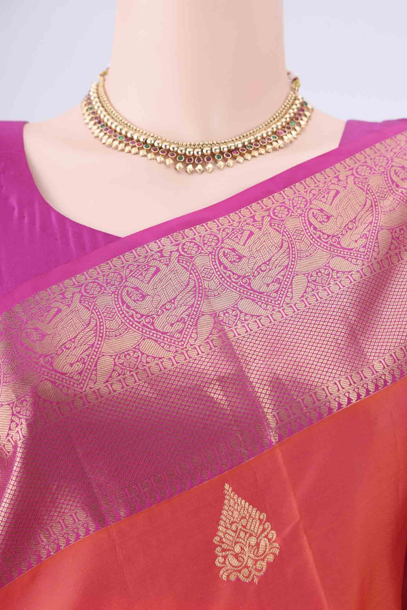 Border image of Orange Soft Silk Saree with Zari Butta on the body and Zari Border. 