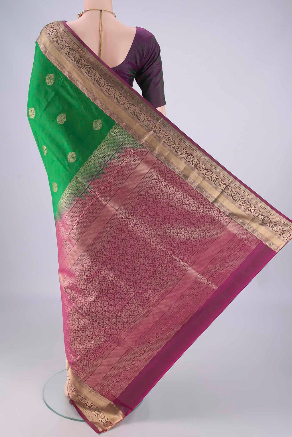 Flat view of Green Soft Silk Saree with Zari Butta on the body and Zari Border. 