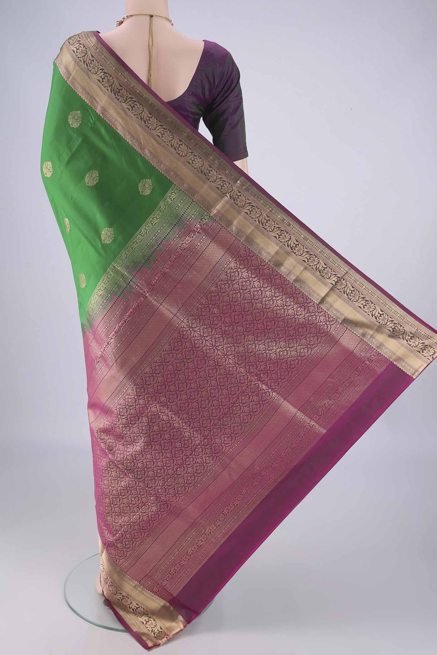Flat view of Green Soft Silk Saree with Zari Butta on the body and Zari Border. 