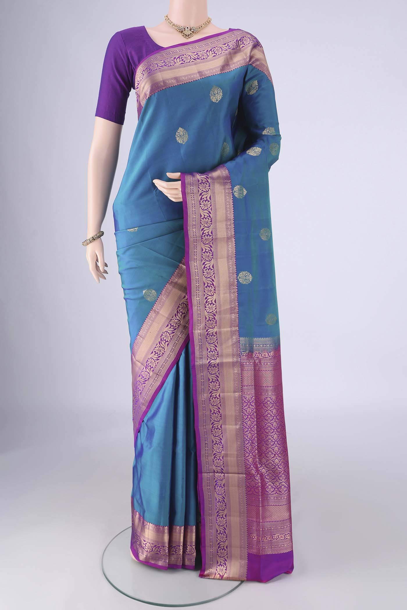 Blue Soft Silk Saree with Zari Butta on the body and Zari Border.  displayed on a mannequin