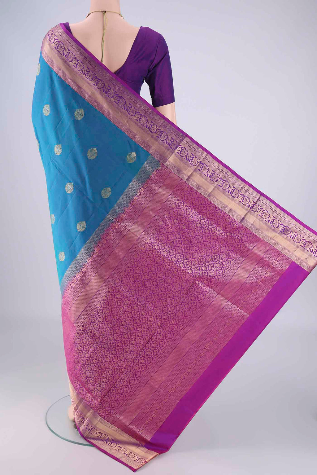 Flat view of Blue Soft Silk Saree with Zari Butta on the body and Zari Border. 