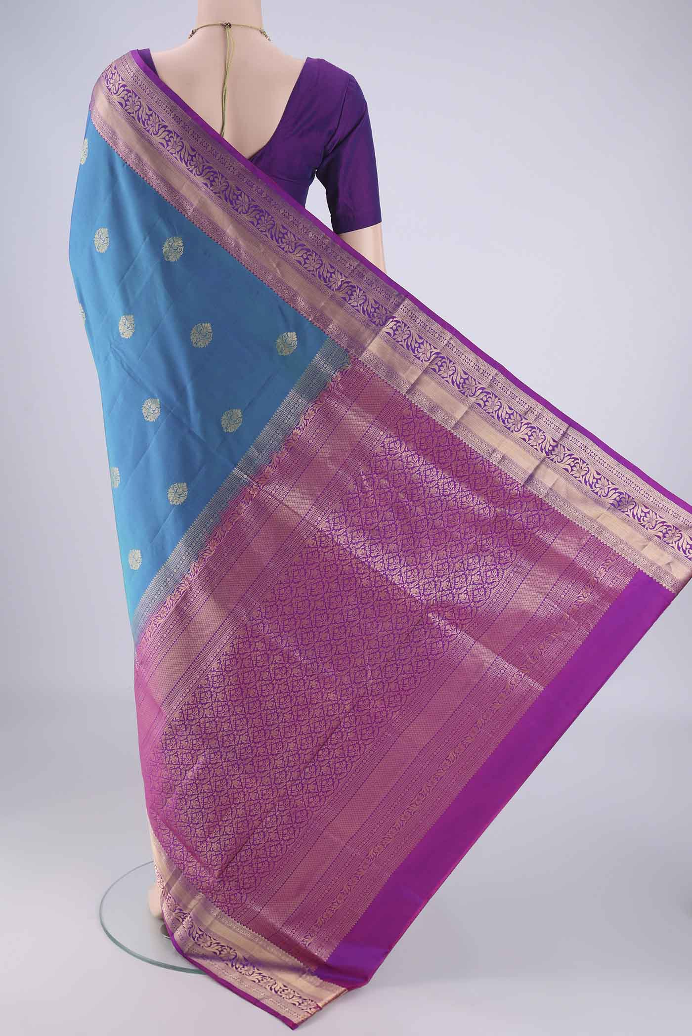 Flat view of Blue Soft Silk Saree with Zari Butta on the body and Zari Border. 