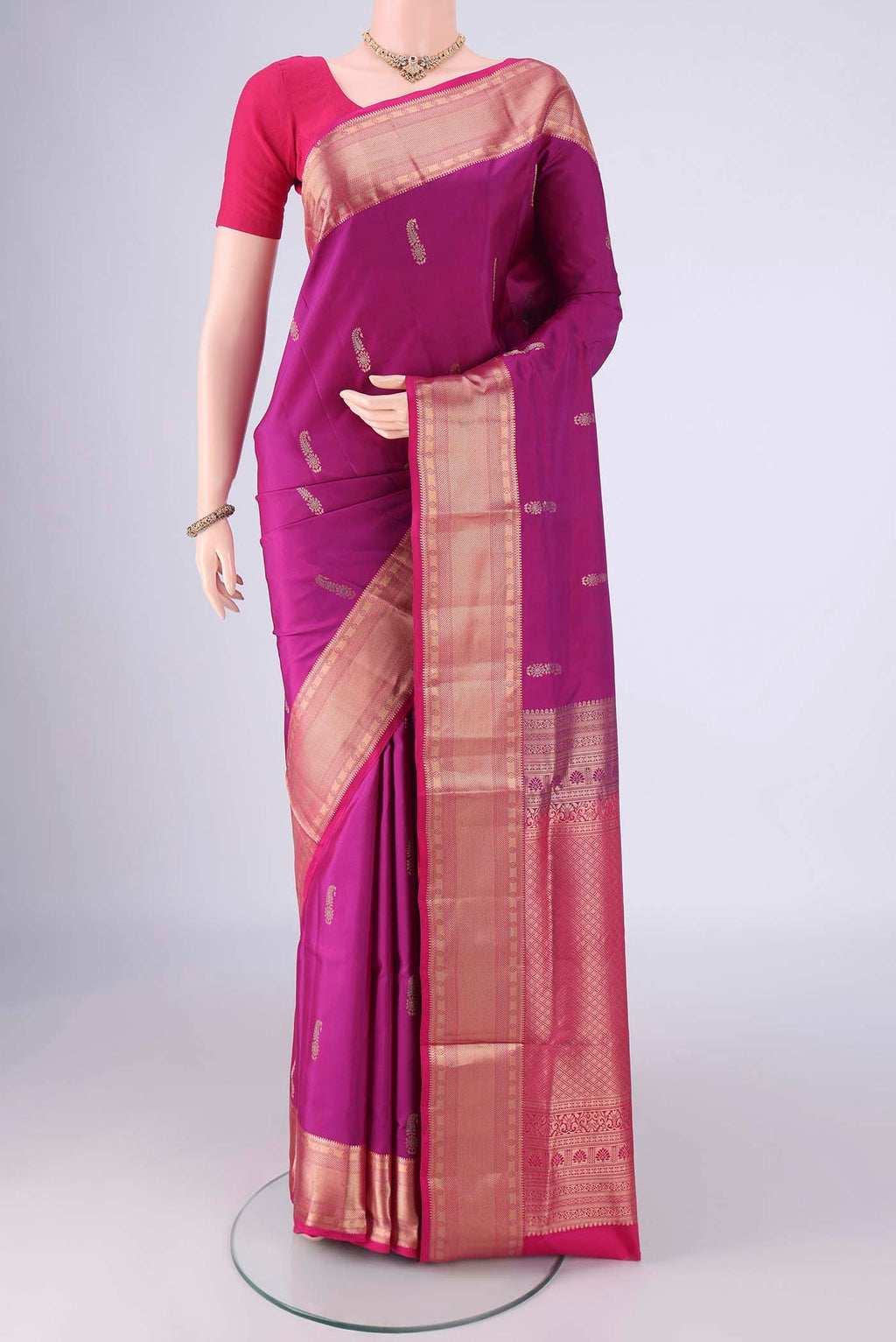 Purple Soft Silk Saree with Zari Butta on the body and Zari Border.  displayed on a mannequin